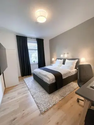Ein Bett oder Betten in einem Zimmer der Unterkunft Modern Cozy apt. -with 2 TV, Netflix and work desk