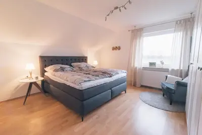 Ein Bett oder Betten in einem Zimmer der Unterkunft Ferienwohnung In den Wiesen