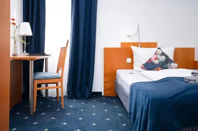 Ein Bett oder Betten in einem Zimmer der Unterkunft Hotel Das Kemperdick