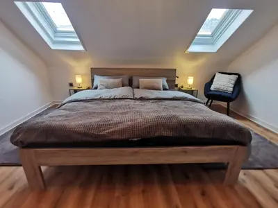 Ein Bett oder Betten in einem Zimmer der Unterkunft Moderne Ferienwohnung Iserlohn 1