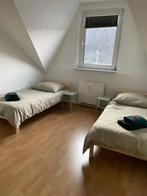 Ein Bett oder Betten in einem Zimmer der Unterkunft SANO - Hagen - Eckesey