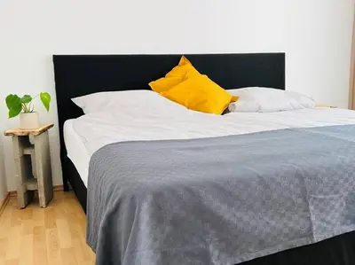 Ein Bett oder Betten in einem Zimmer der Unterkunft Zentrales großzügiges Apartment mit Dachterrasse!