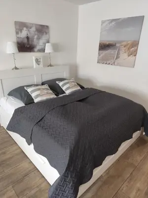 Ein Bett oder Betten in einem Zimmer der Unterkunft Ferienwohnungen Recklinghausen-Nord