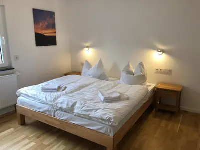 Ein Bett oder Betten in einem Zimmer der Unterkunft Haus am Mühlenkämpchen Wiesengrund