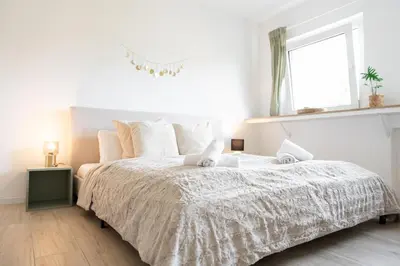 Ein Bett oder Betten in einem Zimmer der Unterkunft Charmante Stadtwohnung