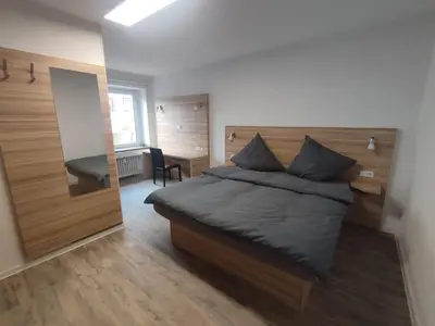 Ein Bett oder Betten in einem Zimmer der Unterkunft City Apartments Essen
