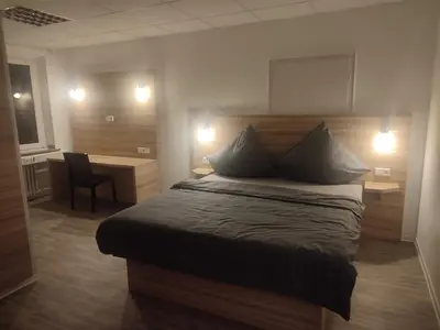 Ein Bett oder Betten in einem Zimmer der Unterkunft City Apartments Essen