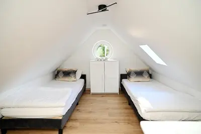 Ein Bett oder Betten in einem Zimmer der Unterkunft Ferienwohnung & Aparts am Schloss Park