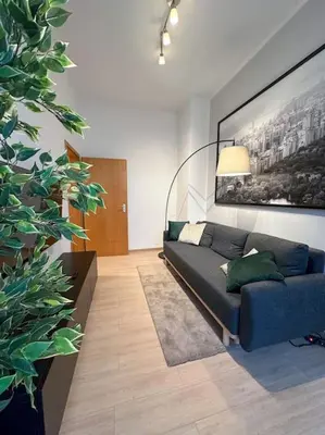 Ein Sitzbereich in der Unterkunft Modern City apt. -with 2 TV, Netflix and work desk