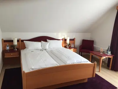Ein Bett oder Betten in einem Zimmer der Unterkunft Akzent Hotel-Restaurant Albert