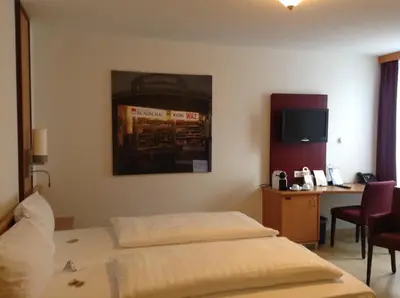 Ein Bett oder Betten in einem Zimmer der Unterkunft Akzent Hotel-Restaurant Albert