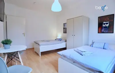 Ein Bett oder Betten in einem Zimmer der Unterkunft BEGE APARTMENTS Corporate Stay