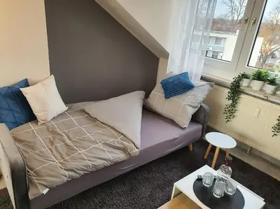 Ein Sitzbereich in der Unterkunft Modernes und ruhiges Appartement mit Loggia