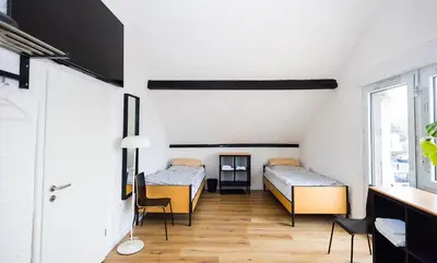 Ein Bett oder Betten in einem Zimmer der Unterkunft Häusliches Loft Wohnung Apartment im Herzen von Ratingen