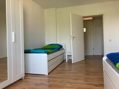 Ein Bett oder Betten in einem Zimmer der Unterkunft gemütliche Altbauwohnung im Wuppertaler Westen