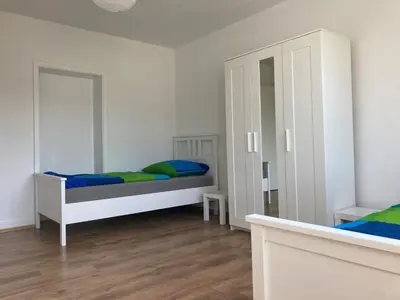 Ein Bett oder Betten in einem Zimmer der Unterkunft gemütliche Altbauwohnung im Wuppertaler Westen