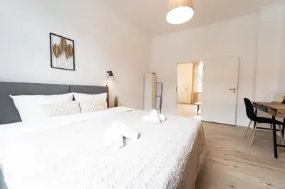 Ein Bett oder Betten in einem Zimmer der Unterkunft Stadtwohnung Helene in Messenähe