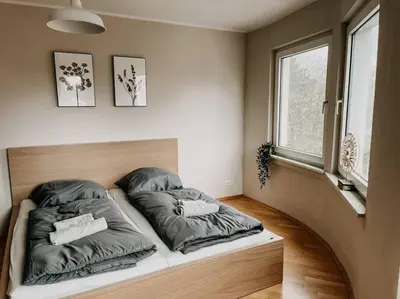 Ein Bett oder Betten in einem Zimmer der Unterkunft Zentral, geräumig, Messe nah! BE2R