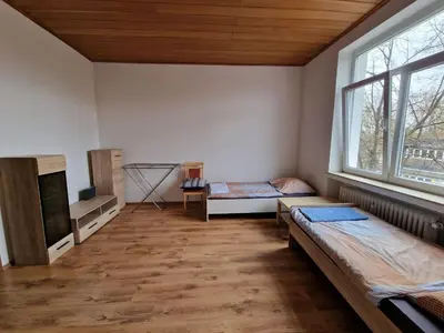 Ein Bett oder Betten in einem Zimmer der Unterkunft K&K Unterkunft GbR, Wohunung 3