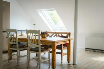Ein Sitzbereich in der Unterkunft Oveney Apartments